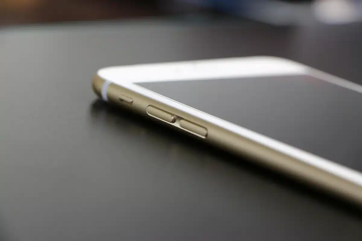 an empty iPhone lock screen with a single line of custom text near the bottom, no logos or identifiable marks